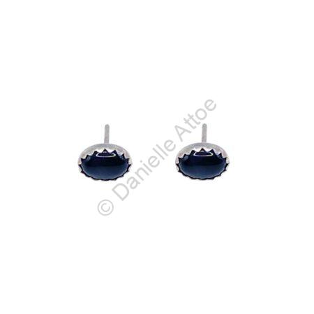 Sterling silver earrings with bezel set, black, oval stones and posts.