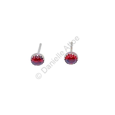 Sterling silver post earrings with round red stones.